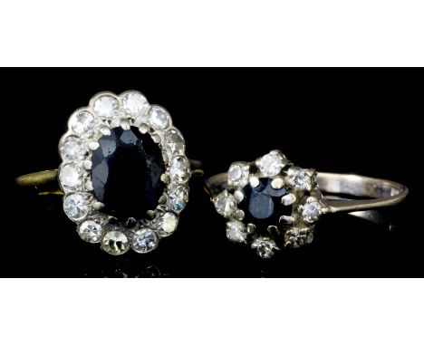 An 18ct gold mounted sapphire and diamond set oval cluster ring, set with central sapphire (approximately 1.25ct), surrounded