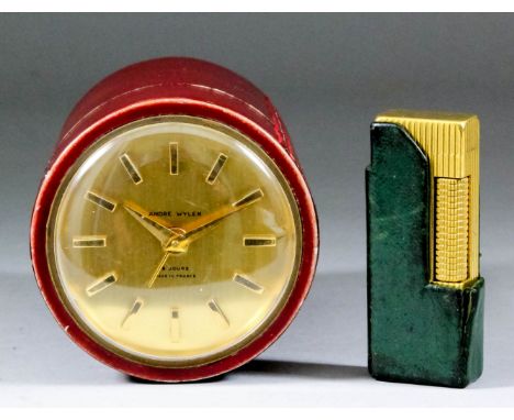A French gilt metal and red leather covered cased cylindrical mantel clock by Andre Wyler, the 2.375ins diameter gilt dial wi