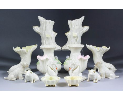A small collection Belleek porcelain, including - pair of cornucopia vases, 5ins high, a pair of flared vases, the sides moul