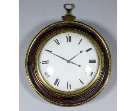 An early 19th Century brass bound oak circular "Sedan" clock, the 4ins diameter white enamel dial with Roman numerals, to the