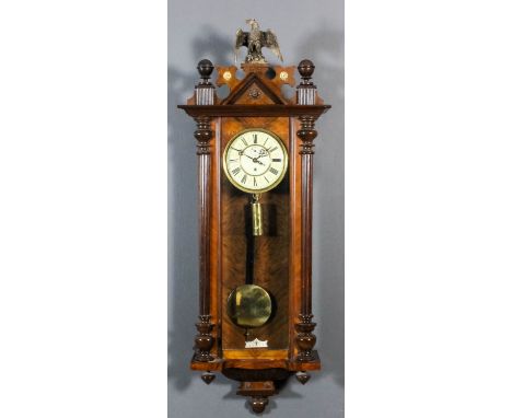 A late 19th Century walnut cased "Vienna Regulator", the 7ins diameter cream enamel dial with Roman numerals and subsidiary s