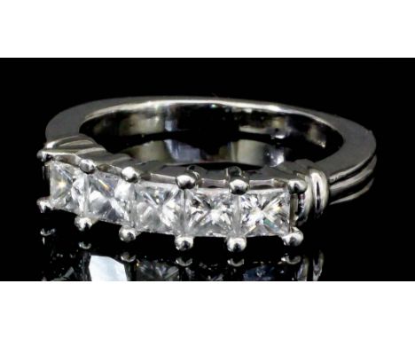 A modern platinum mounted five stone diamond ring, set with emerald cut diamonds in raised channel, (approximate total diamon