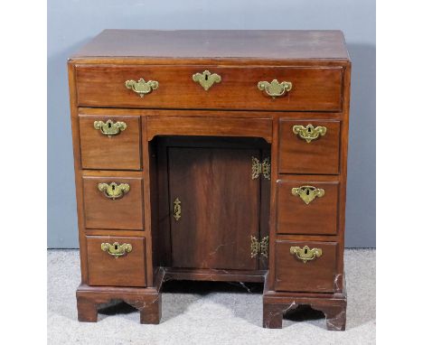 An early George III lady's mahogany dressing table, the plain top with moulded caddy edge, fitted one frieze drawer above cen