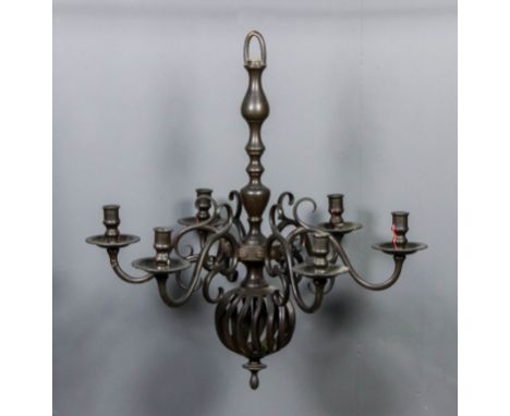 A bronzed metal six light chandelier, the knopped stem with bulbous open spiral pendant and six scroll branches, 24ins diamet