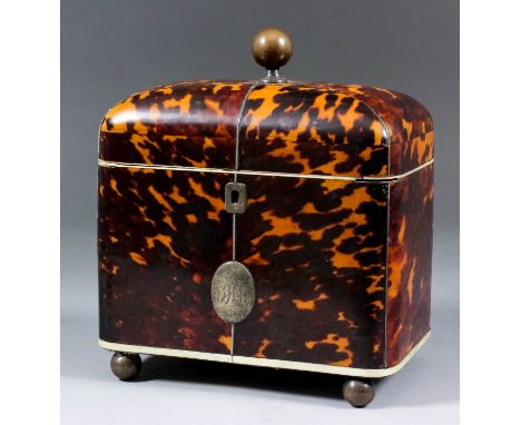 An early 19th Century tortoise shell rectangular two-division tea caddy, the domed top inlaid with pewter and ivory stringing