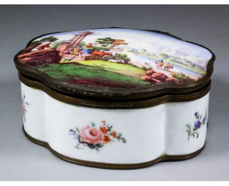 A late 18th Century Staffordshire enamel oval box of shaped outline, the lid enamelled in colours with an idyllic landscape, 