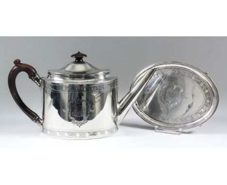 A George III silver oval tea pot, the domed lid and body engraved with bands of oval cartouche and leaf and floral ornament, 