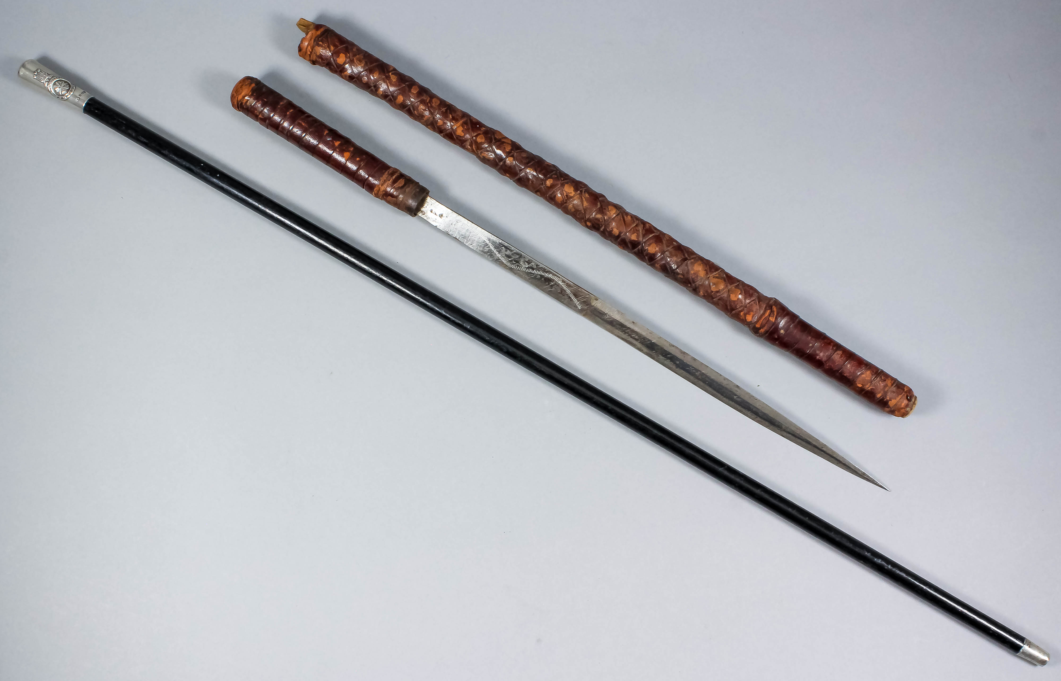 A 20th Century sword stick, the 13.5ins steel blade with stylised ...