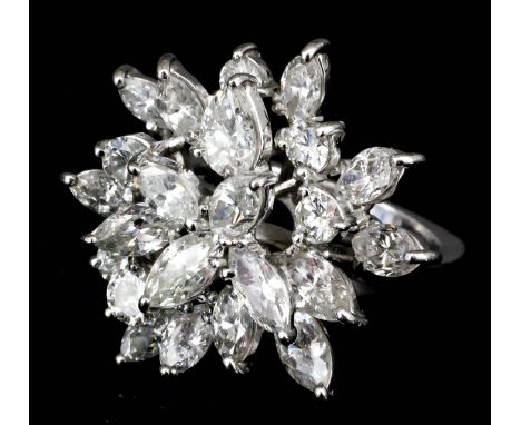 A modern 18ct white gold mounted diamond cluster ring of floral design set with brilliant cut marquise and round diamonds (ap