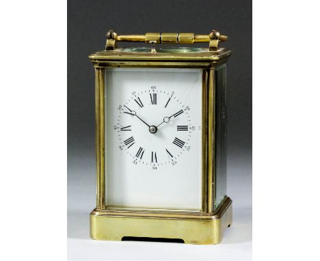 A French carriage clock, the white enamel dial with Roman and Arabic numerals to the eight day two train movement striking on