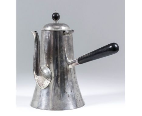 An Edward VII silver chocolate pot in the manner of Christopher Dresser, the slightly domed cover with ebonised finial, taper