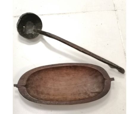 Hand carved tribal oval bowl with carved border, 49 cm length, 22 cm wide, 5 cm high, t/w hand carved ladle, 61 cm length. 