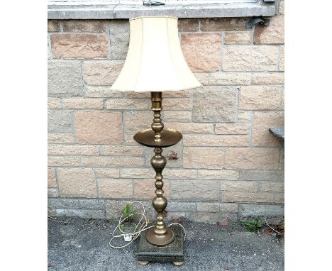 Indian embossed brass floor lamp, on heavy granite base,1 corner a/f and added wooden bun feet, 140 cm high, to include shade