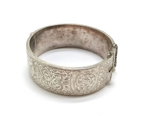 Silver hallmarked bangle with engraved detail to front - 5.5cm internal diameter &amp; 34g 