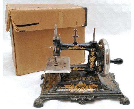 Vintage German Child's sewing machine, with original box, in good used condition. 
