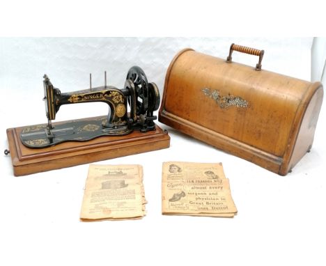 Vintage cased Singer sewing machine, The Family Machine, with some original paperwork. 