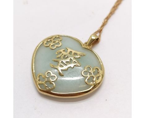 9ct marked gold mounted heart shaped jade pendant on a 9ct marked gold 44cm chain - total weight 7.3g 