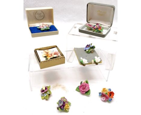 Qty of ceramic floral brooches, pins etc - some losses 