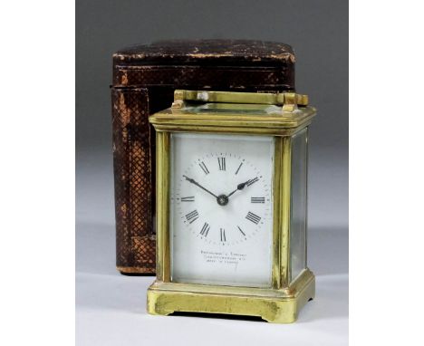 A late 19th/early 20th Century French miniature carriage timepiece, the white enamel dial with Roman numerals, inscribed with
