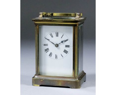 An early 20th Century French carriage timepiece, the white enamel dial with Roman numerals, to the eight day single train mov