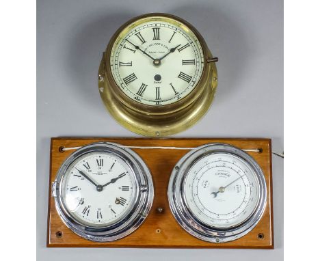 A Sestral brass bulkhead timepiece retailed by Henry Browne & Son Ltd of Barking & London, the 5.75ins diameter cream enamel 
