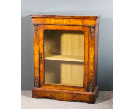 A late Victorian walnut and gilt metal mounted dwarf display cabinet with moulded edge to top, frieze inlaid with flowers, fi