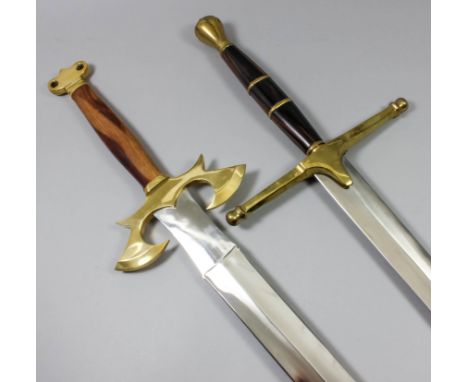 A modern two handed fantasy broadsword with a 30ins bright steel double edged blade, heavy brass cross guard and pommel, hard