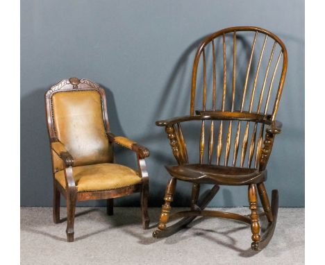 A stained ash wood rocking Windsor armchair with two tier stick back, solid shaped seat, on turned supports, and a child's st