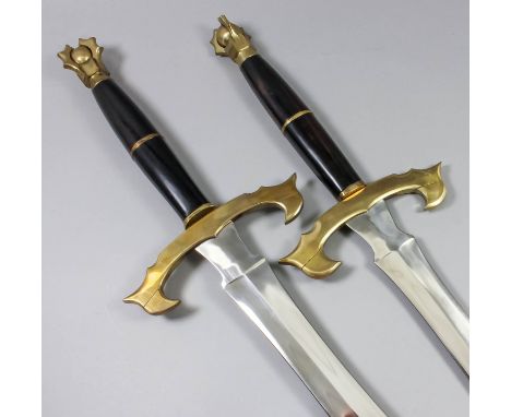 A modern fantasy two handed broadsword, with 31ins bright steel double edged blade, heavy brass cross guard, and pommel, hard