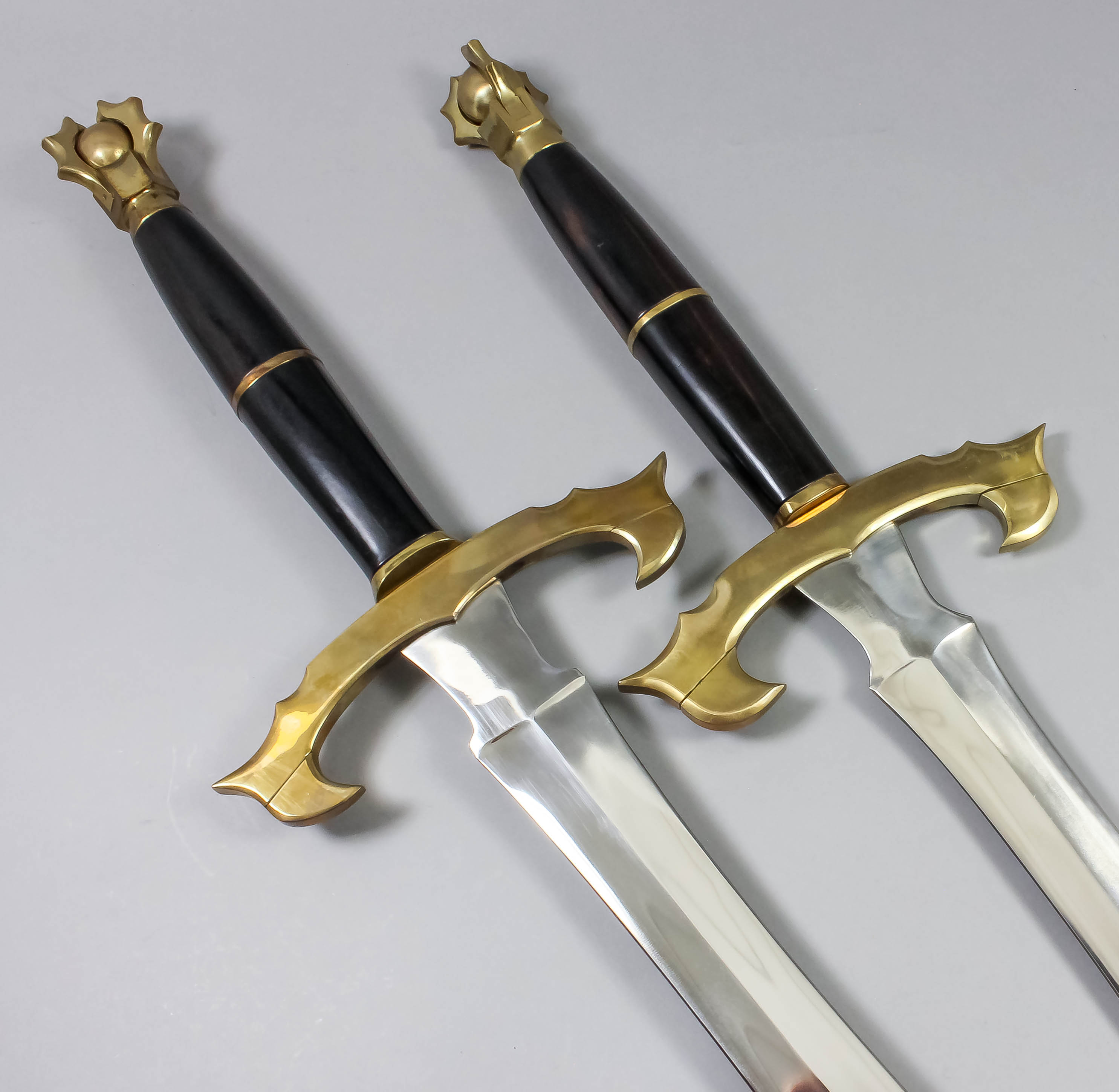 A Modern Fantasy Two Handed Broadsword With 31ins Bright Steel Double Edged Blade Heavy Brass C