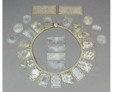 Three late 19th Century Chinese mother-of-pearl rectangular gaming counters deeply carved with figures in landscapes, 2.75ins