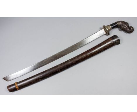 A Far Eastern Pedang, 21ins plain chisel pointed blade, heavily decorated wood and metal grip, wood scabbard, 28ins overall