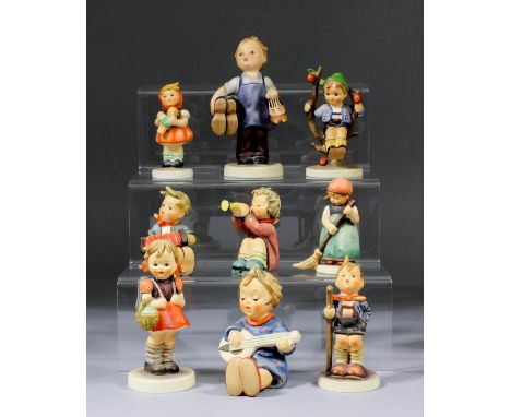 A small collection of Hummel pottery figures, including - "Apple Boy", 4ins high, "Boy Cobbler with Boots", 5.25ins high, "Gi