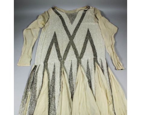 A 1920s white and silver bugle beaded flapper dress with pale coffee chiffon, worked in a chevron pattern with kick pleats, 3