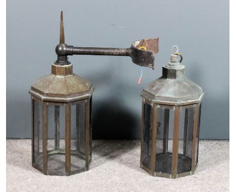 A copper and tinted glass light fitting, 18ins high, and a similar mounted on wrought iron bracket with pointed finial, 24ins