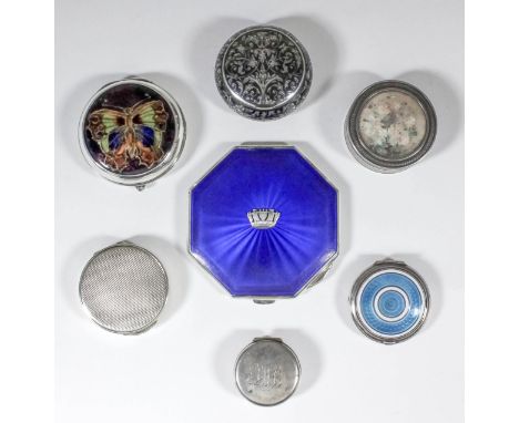 A George VI silver and royal blue guilloche enamel octagonal compact with crown to lid and engine turned back, 3ins wide, by 