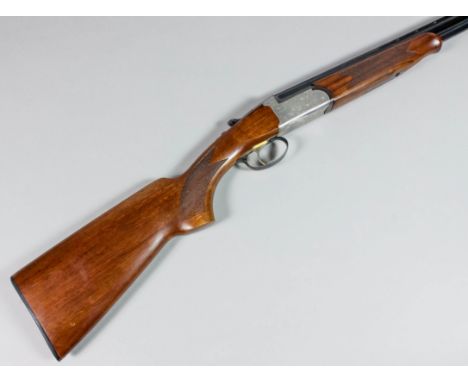 A .410 over and under shotgun by Roato Luciano, Serial No. 01065, 28ins blued steel barrels with raised top rib, bright steel