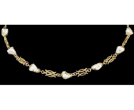 A late Victorian gold coloured metal mounted freshwater mussel baroque pearl necklace with seven baroque pearls in free form 