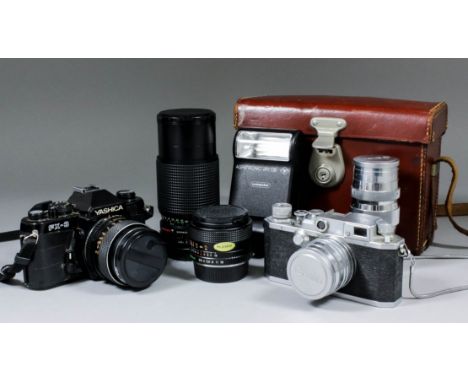 A Yashica FX-3 single lens reflex camera, body No. 213417, with accessories, and a Canon camera, body No. 71206, with "Serena