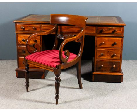 A Victorian mahogany kneehole desk with moulded edge and tan leather inset to top, fitted nine drawers, on plinth base, 57ins