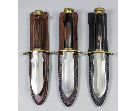 Three modern archers daggers, each with 5ins double edged bright steel blade, brass cross guard and pommel, hardwood grip and