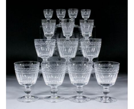 A part suite of Stuart slice and panel cut drinking glasses, with single knops to stems, comprising - six 2.67ins liqueur gla