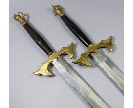 A pair of modern fantasy double handed broadswords, 30ins bright steel doubled edged blade, heave brass cross guard and pomme