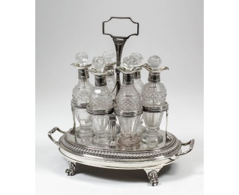 A good George III silver oval six-division cruet with moulded framework and rectangular loop handle, the oval two-handled bas