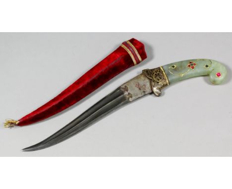 A Mughal style celadon jade handled dagger, the 7.625ins Damascus steel blade with hilt  embellished with pink and red stones