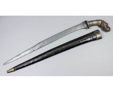 A Far Eastern Pedang, 21ins semi curved blade, heavily decorated silvery metal and wood grip, wood, leather and silvery metal