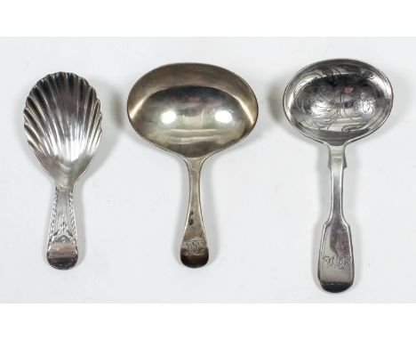 A George III silver caddy spoon with shell pattern  bowl and bright cut handle, by Stephen Adams, London 1797, a ditto silver