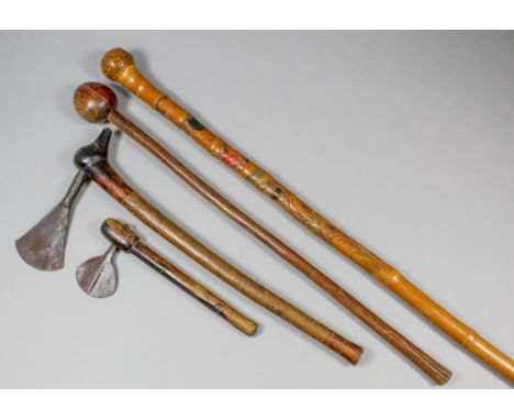 A steel axe with carved birds head handle, 18ins long, another, 9.25ins long, a club, the handle with shallow incised decorat