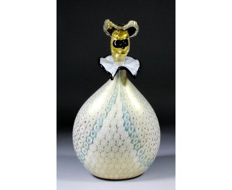 A Venetian glass ovoid decanter in the form of a carnival figure with masked face pattern stopper, the ovoid body decorated w