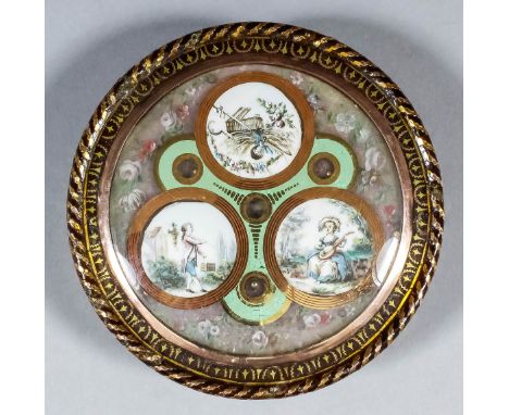 A late 18th Century Continental tortoiseshell and gold inlaid circular snuff box with three painted vignettes to the lid, wit